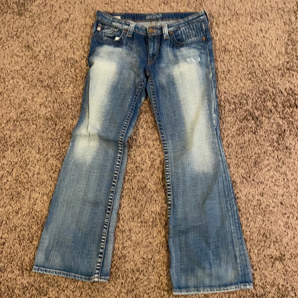 Distressed large flare big star jeans.